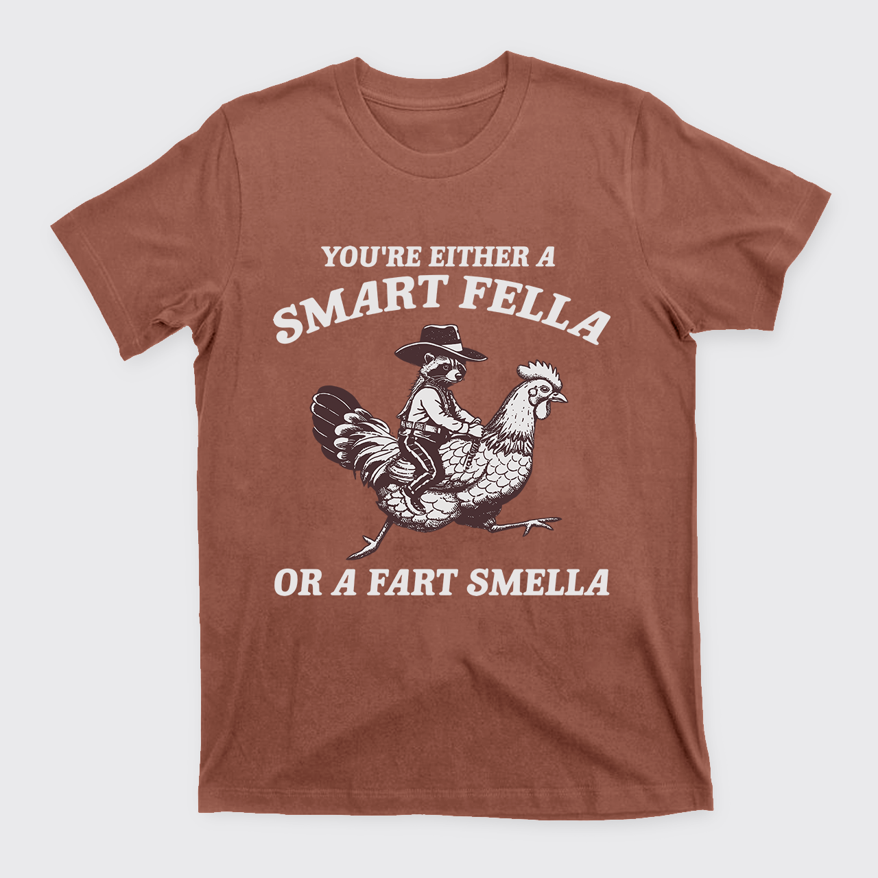 The Raccoon Rides The Chicken T-Shirts